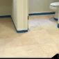 a painted travertine floor which has been painted white