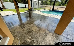 a floor made of travertine tiles that are freshly sealed